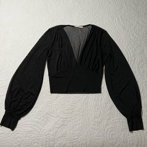 Black mesh crop top with ballon sleeves. Size small.